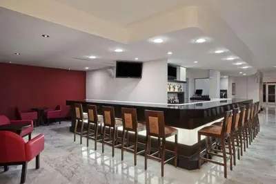 Una televisión o centro de entretenimiento en Hilton Garden Inn Tuxtla Gutierrez