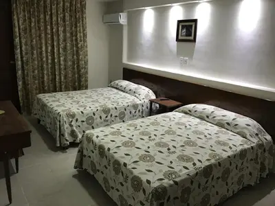 Cama o camas de una habitación en Hotel Oriente