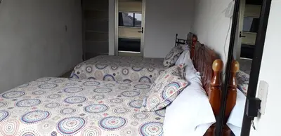 Cama o camas de una habitación en Hotel Posada Sernichari