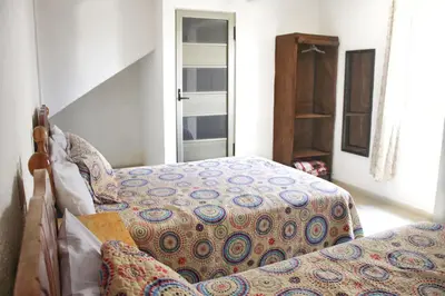 Cama o camas de una habitación en Hotel Posada Sernichari