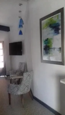Una televisión o centro de entretenimiento en Hotel Canaria