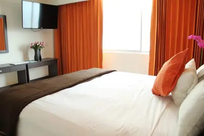 Cama o camas de una habitación en Hotel María Eugenia Tuxtla Gutiérrez