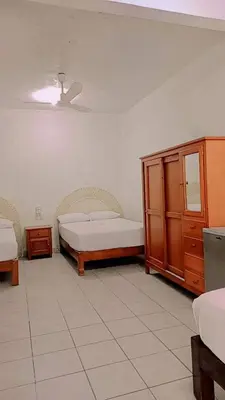 Cama o camas de una habitación en Hotel y Bungalows Acuario