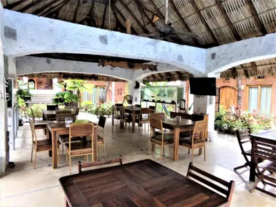 Un restaurante o sitio para comer en Hotel Casa de Lirio Diamante