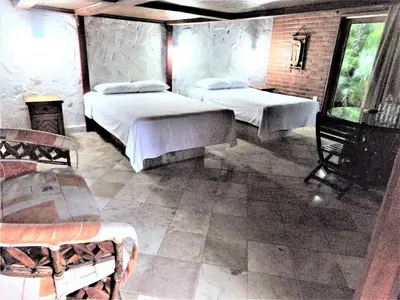 Cama o camas de una habitación en Hotel Casa de Lirio Diamante