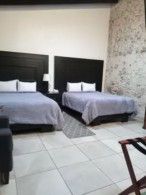 Cama o camas de una habitación en Hotel Boutique Casabella