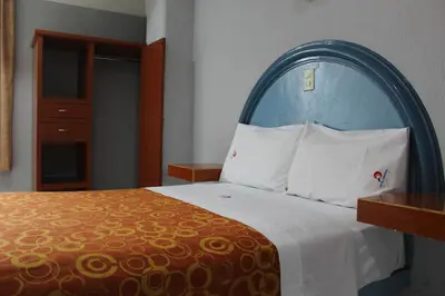 Cama o camas de una habitación en Hotel Central Puebla