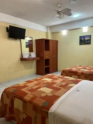Cama o camas de una habitación en Hotel Central Puebla
