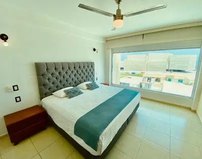 Cama o camas de una habitación en FRENTE PLAYA vista al mar, PISCINA DE USO EXCLUSIVO