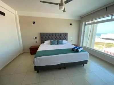 Cama o camas de una habitación en FRENTE PLAYA vista al mar, PISCINA DE USO EXCLUSIVO