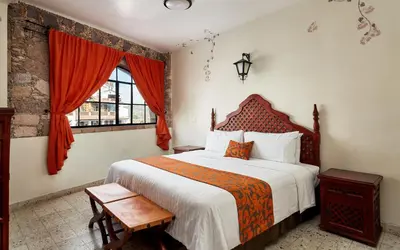 Cama o camas de una habitación en Hotel Agua Escondida