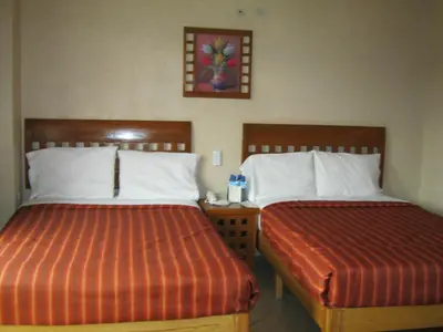 Cama o camas de una habitación en Hotel Real Santa María