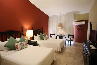 Cama o camas de una habitación en Hotel Montetaxco