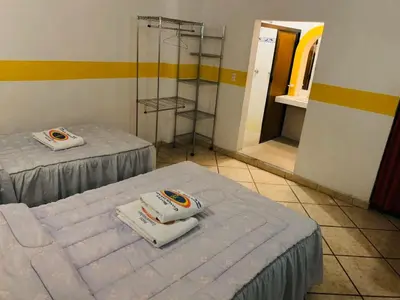 Cama o camas de una habitación en Hotel Real Jojutla