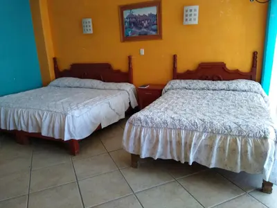Cama o camas de una habitación en Hotel Real Jojutla