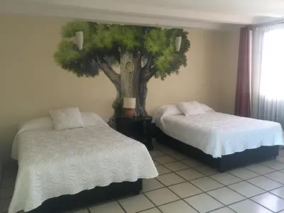Cama o camas de una habitación en Hotel Calli Quetzalcoatl
