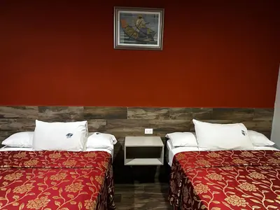 Cama o camas de una habitación en Hotel Teresita