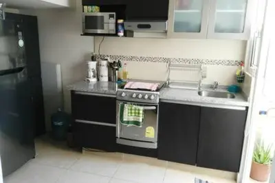 Una cocina o zona de cocina en Casa con alberca y laguna