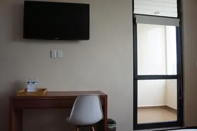 Una televisión o centro de entretenimiento en Hotel Mirante Tlaxcala