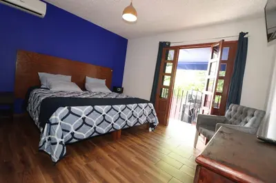 Cama o camas de una habitación en Hotel Casa Frida