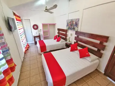 Cama o camas de una habitación en Casa de Huespedes Cielito Lindo