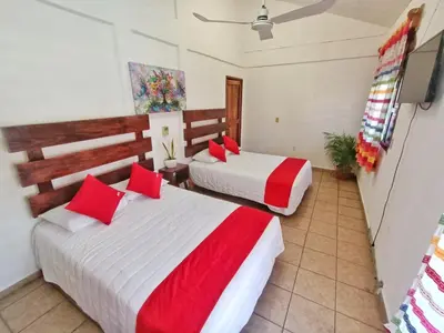 Cama o camas de una habitación en Casa de Huespedes Cielito Lindo