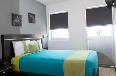 Cama o camas de una habitación en Hotel Misión Express Xalapa