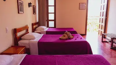 Cama o camas de una habitación en Hotel Las Golondrinas
