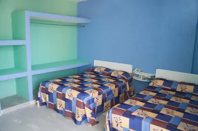 Cama o camas de una habitación en Dorados Acapulco