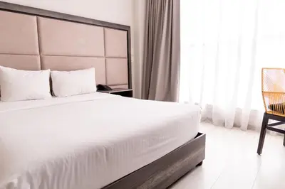 Cama o camas de una habitación en Arkana Puebla by Grupo Amber