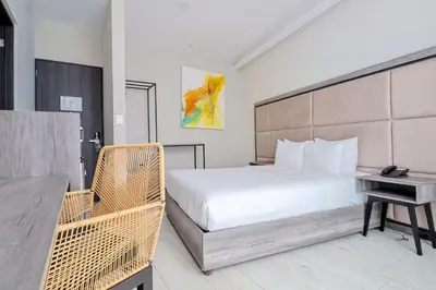 Cama o camas de una habitación en Arkana Puebla by Grupo Amber