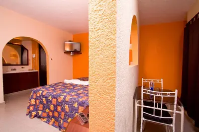 Cama o camas de una habitación en Hotel & Motel Hacienda Jiutepec
