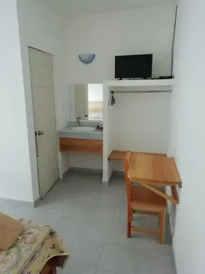Una televisión o centro de entretenimiento en Hotel Quinta Paraiso