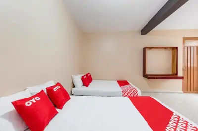 Cama o camas de una habitación en OYO Hotel Emperador, Oaxaca