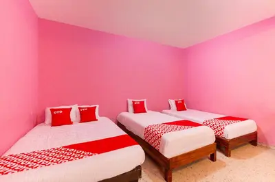 Cama o camas de una habitación en OYO Hotel Emperador, Oaxaca