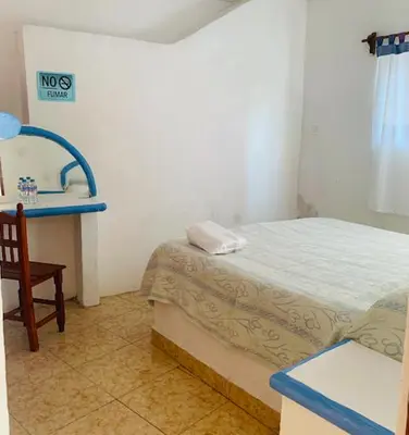 Cama o camas de una habitación en Hotel Puerto Villamar