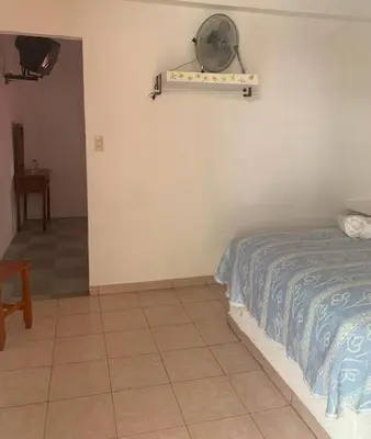 Cama o camas de una habitación en Hotel Puerto Villamar