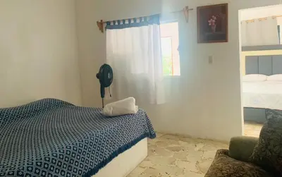 Cama o camas de una habitación en Hotel Puerto Villamar