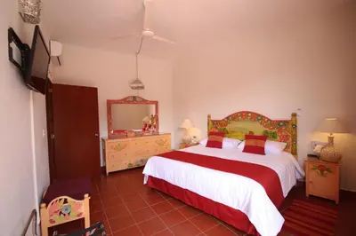 Cama o camas de una habitación en Hotel Hacienda Don Cenobio