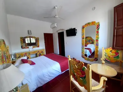 Cama o camas de una habitación en Hotel Hacienda Don Cenobio