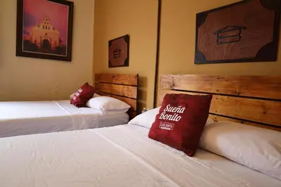 Cama o camas de una habitación en Casa Bonita Hotel y Hostal