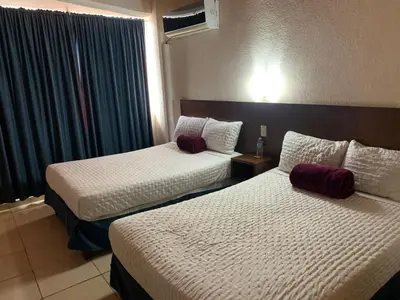 Cama o camas de una habitación en Gran Santiago Plaza