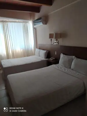 Cama o camas de una habitación en Gran Santiago Plaza