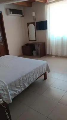Cama o camas de una habitación en Gran Santiago Plaza