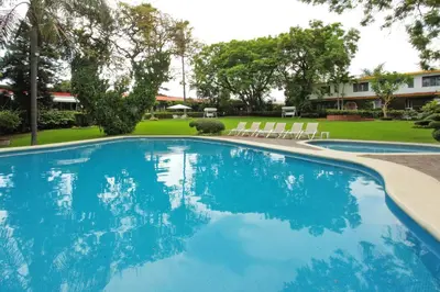 Piscina en o cerca de Hotel Posada Quinta Las Flores