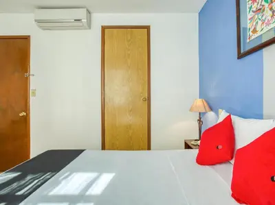 Cama o camas de una habitación en Capital O Parador Crespo Hotel, Oaxaca