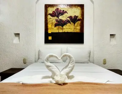 Cama o camas de una habitación en D'Cesar Hotel Acapulco