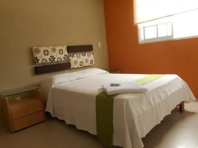 Cama o camas de una habitación en Hermosa Casa Acapulco Diamante Hospedaje a 5 min de la playa