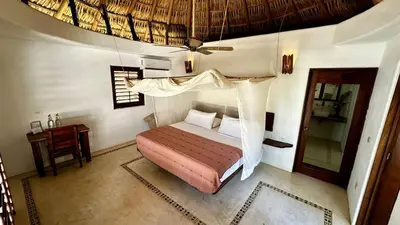 Cama o camas de una habitación en El Alquimista Yoga Spa