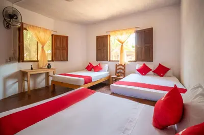 Cama o camas de una habitación en OYO Cabañas Abril, Mazunte
